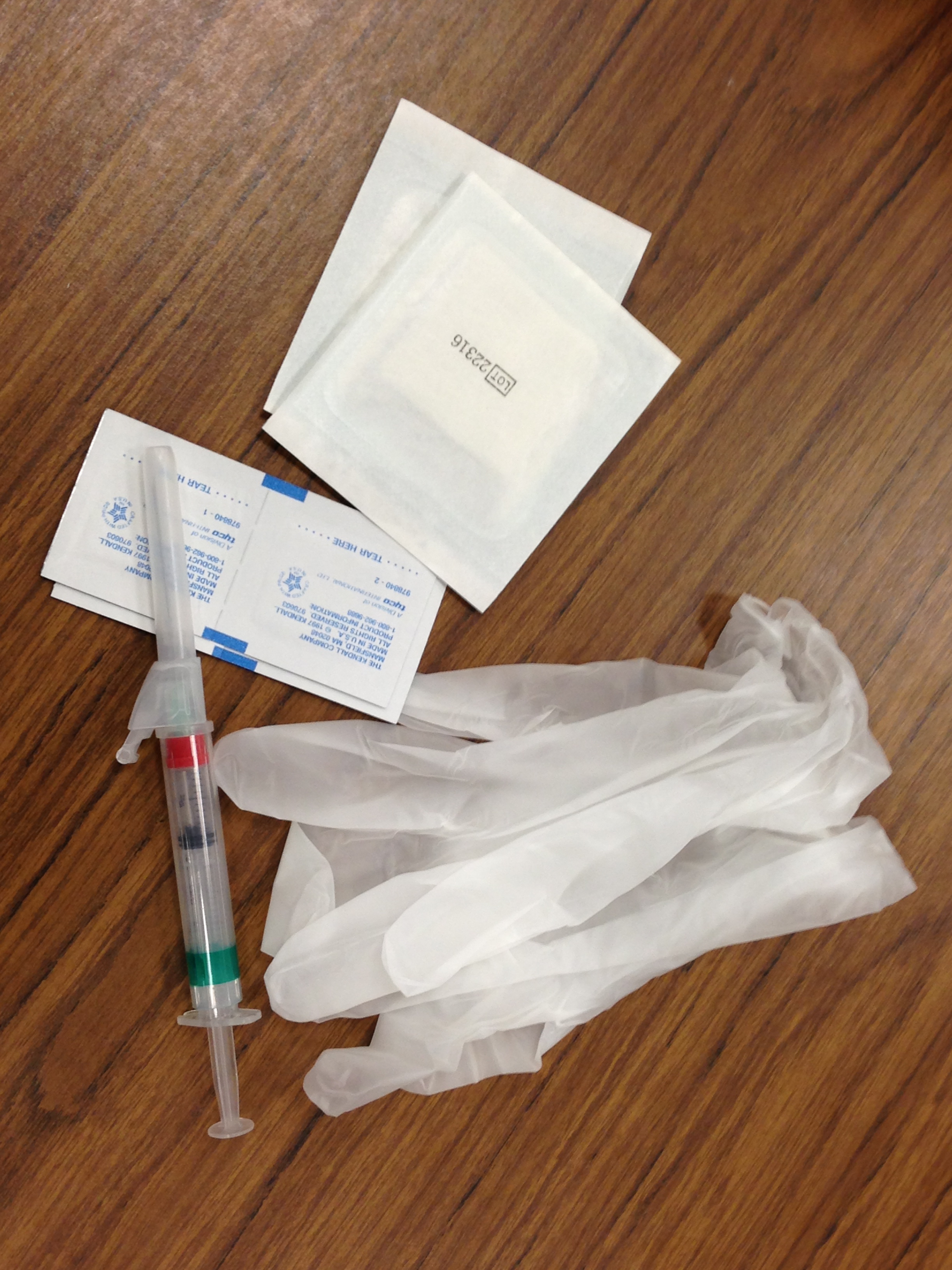 think image is of supplies used to prepare and administer intramuscular injections